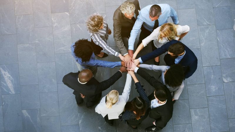 from-above-black-and-white-coworkers-having-teambu-2025-10-01-16-15-03-utc