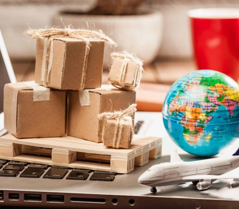 Global logistics concept with online trading and shopping in the internet, packages to be delivered after ordering on the computer